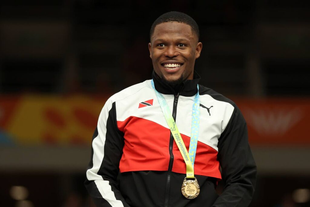 Gold medallist Trinidad and Tobago's Nicholas Paul celebrates during a medal ceremony for the men's keirin final at the Commonwealth Games track cycling at Lee Valley VeloPark in London, England on Saturday. (AP PHOTOS) - via newsday.co.tt