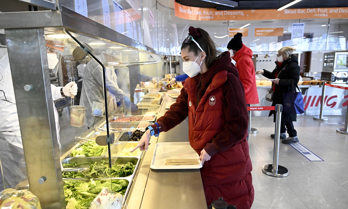 An athlete orders food at a restaurant at the Olympic Village on February 1, 2022, in Beijing. Photo: VCG