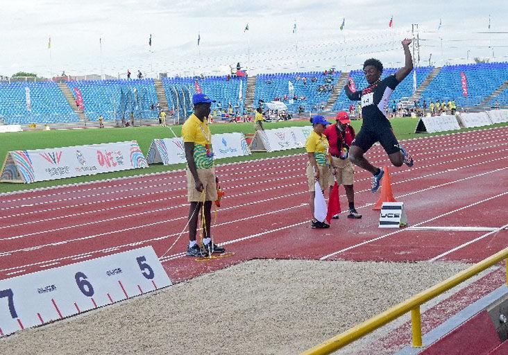 STEELE 4TH IN LONG JUMP: Trinidad and Tobago’s Andrew Steele competes in the Commonwealth Youth Games (CYG) men’s long jump event at the Hasely Crawford Stadium, in Port of Spain, yesterday. Steele finished fourth with a 7.16 metres leap. —Photo: JERMAINE CRUICKSHANK (Image obtained at trinidadexpress.com)