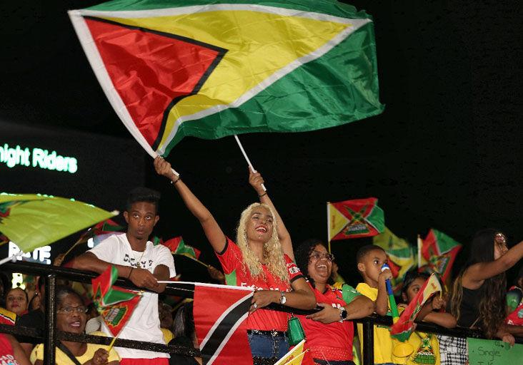 FERVENT SUPPORT: Fans show their support during the Republic Bank Caribbean Premier League T20 Qualifier 1 match between the Guyana Amazon Warriors and Trinbago Knight Riders at Providence Stadium last Wednesday night, in Georgetown, Guyana. TKR won the contest to advance directly to the final. The teams clashed again last night in the championship match after the Amazon Warriors eliminated the 2022 champions, Jamaica Tallawahs, in Qualifier 2 on Friday night.  —Photo: Ashley Allen-CPL T20/Getty Images (Image obtained at trinidadexpress.com)
