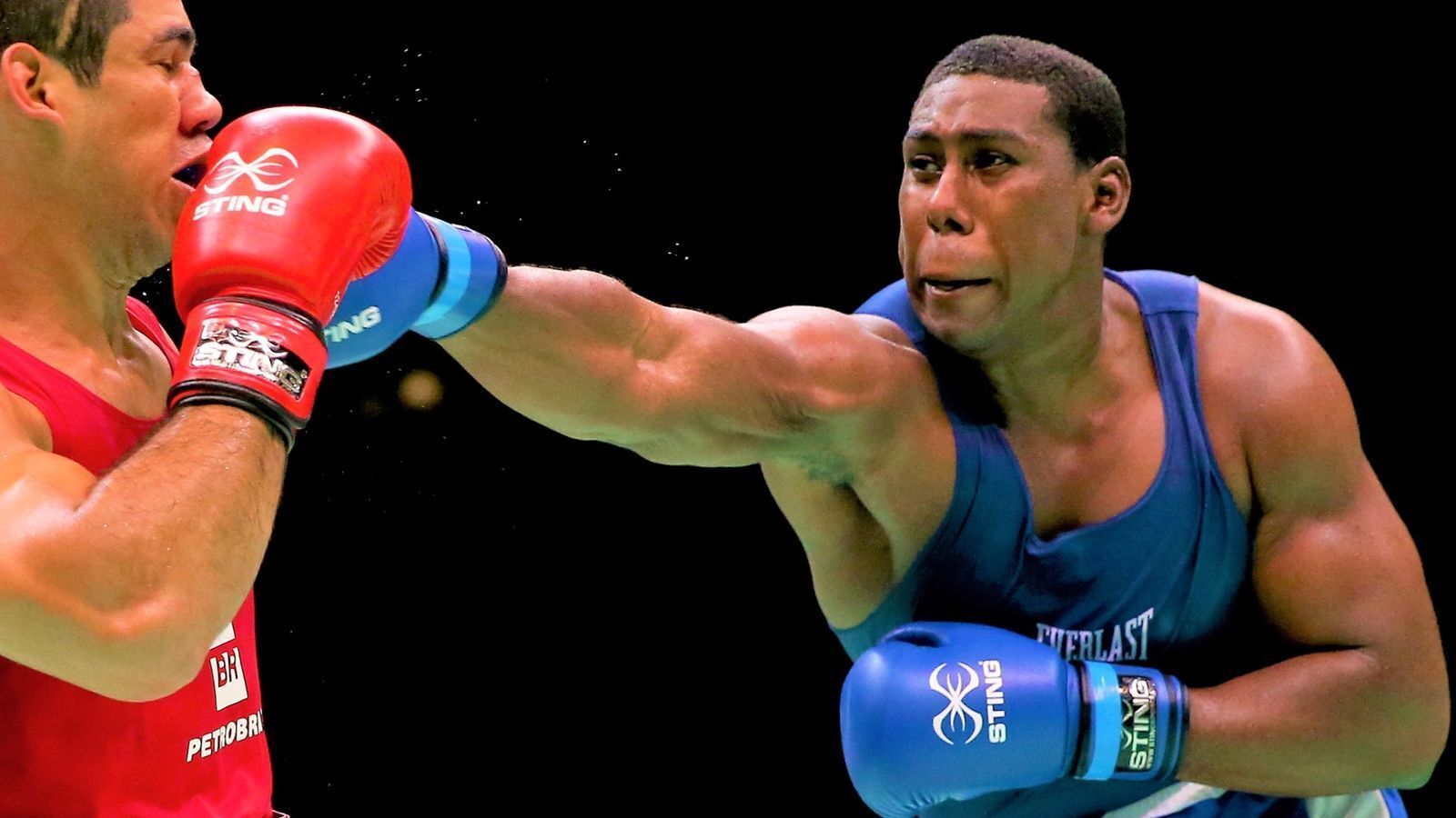FILE- T&T's Nigel Paul, right, vying for a spot on the national boxing team for the Commonweaalth Games. (Image obtained at guardian.co.tt)